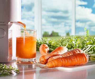 Carrot being juiced