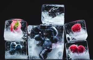 Ice With Frozen Fruit Ready To Be Blended