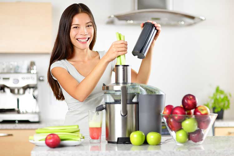 Woman making celery juice