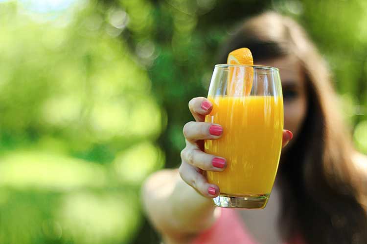 Girl Drinking juice in morning